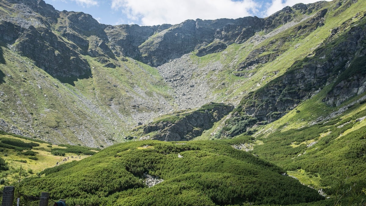 green mountains under white clouds during daytime